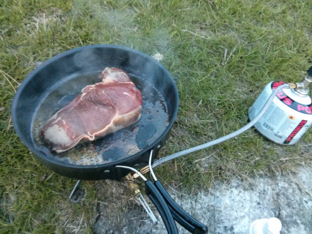 Frying up a steak for supper