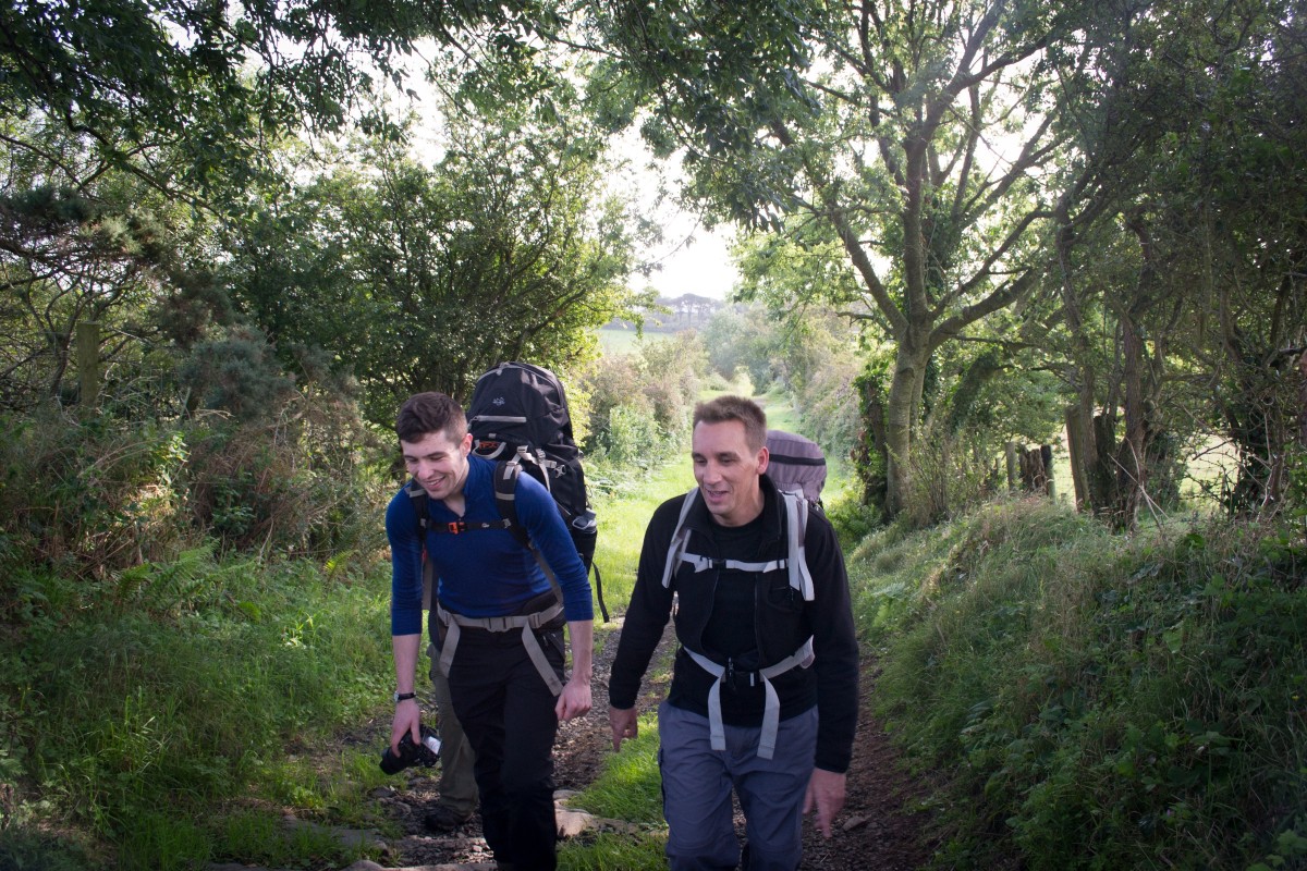 Oisin and Dave walking a nice country lane