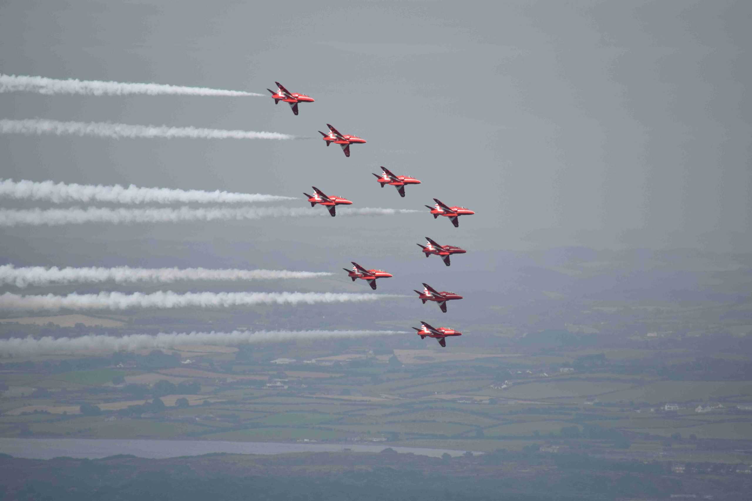 Video: Newcastle Festival of Flight 2016 and Wild Camping at Drinnevar and Tollymore Fighter jets performing a synchronized aerial display over the landscape, leaving white smoke trails during an airshow, showcasing precision flying and aviation skills.