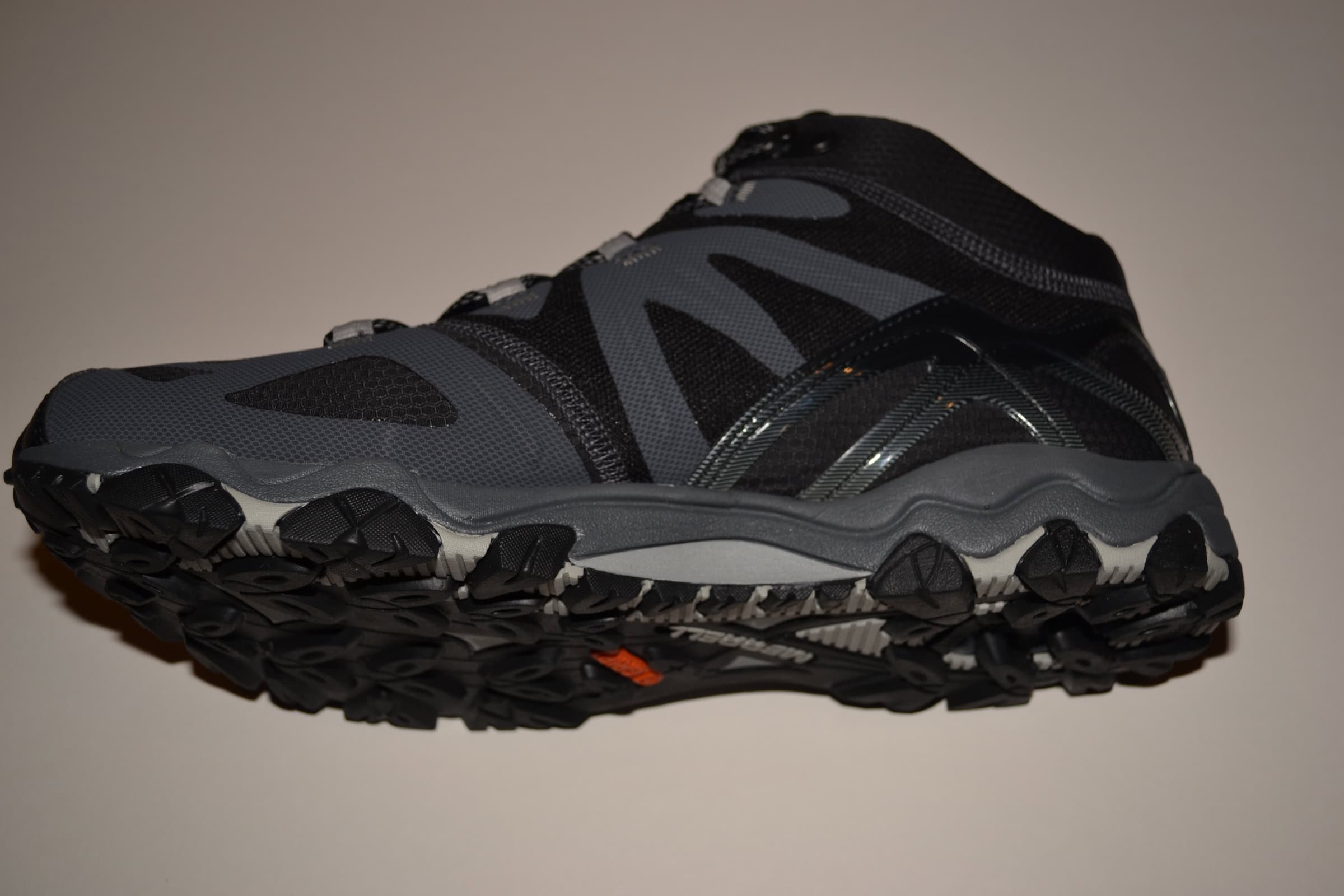 Merrell Grassbow Boot Review Comfortable black and gray hiking trail running shoe with durable grip sole for outdoor adventures. Ideal for hiking, trail running, and mountain trekking with superior traction and support.