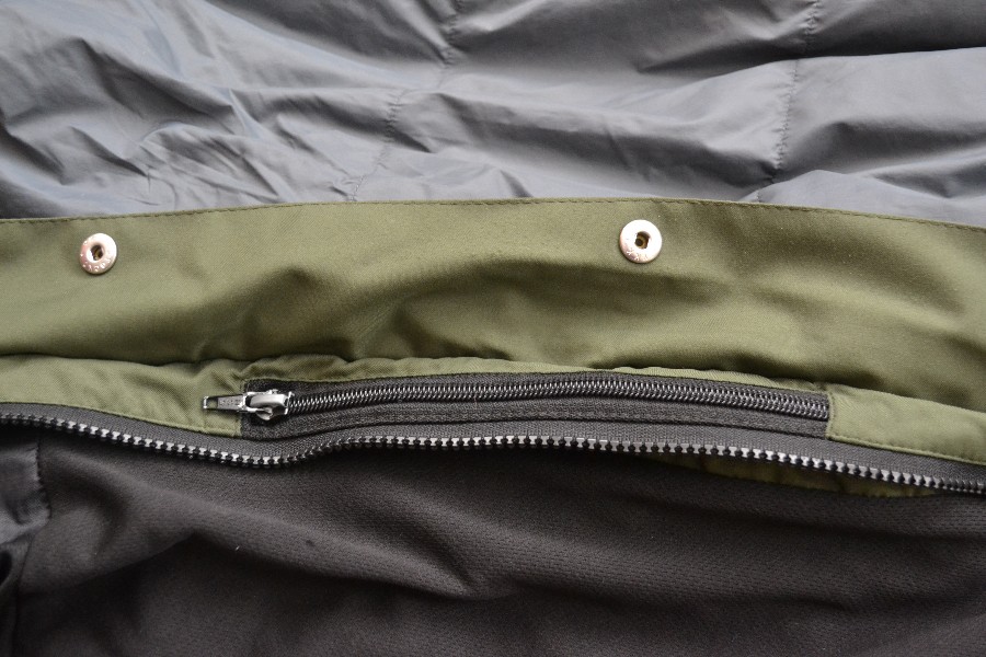 Full length zip with storm flap and chest pocket