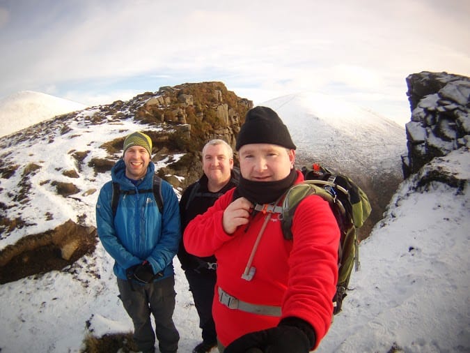 Great gift ideas for friends who love the outdoors Snowy mountain hiking with a group of friends, trekking gear and backpacks in a winter landscape. Empowering outdoor adventure and trekking experiences in rugged terrain.