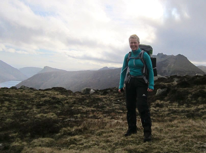Early Spring Mourne Walk Elegant hiker with backpack enjoying scenic mountain landscape, outdoor adventure, trekking, trekking gear, wilderness exploration, nature trail, hiking expedition, adventure travel, outdoor activities, mountain trekking, exploring nature, hiking tips.