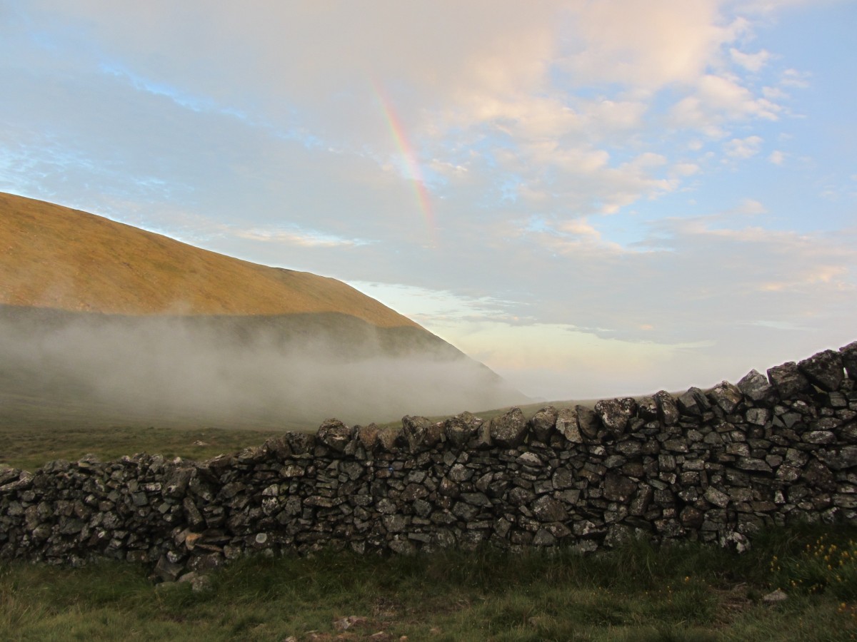 Approaching clouds and rainbow