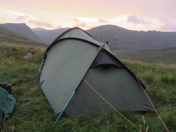 Photo Album: Sunshine to Storm Easy-to-assemble lightweight camping tent set up in scenic mountain landscape during sunset, ideal for backpackers and outdoor enthusiasts seeking adventure.