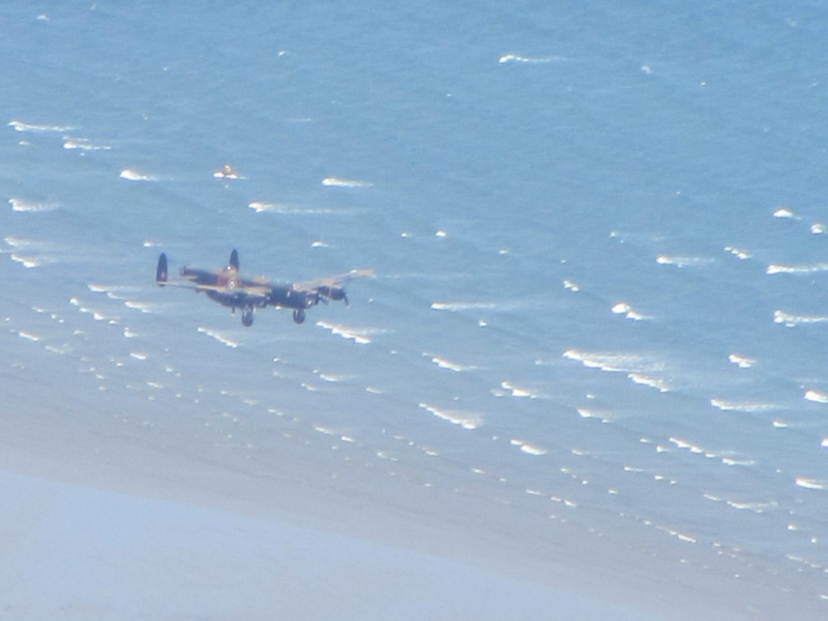 lancaster bomber along the beach
