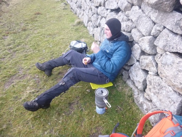 Chris enjoying the wind break from the wall